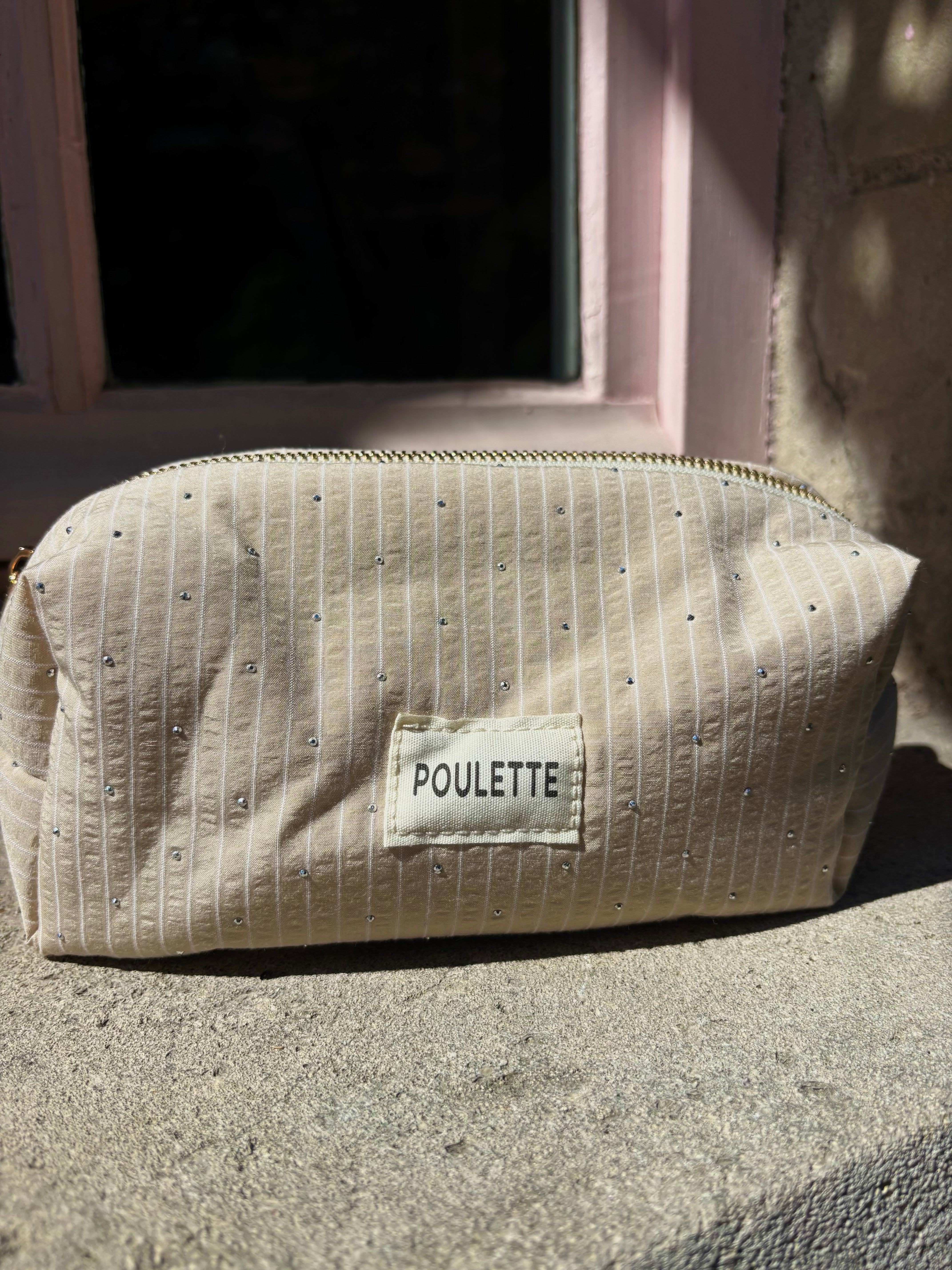 Trousse de toilette beige à rayures et stras